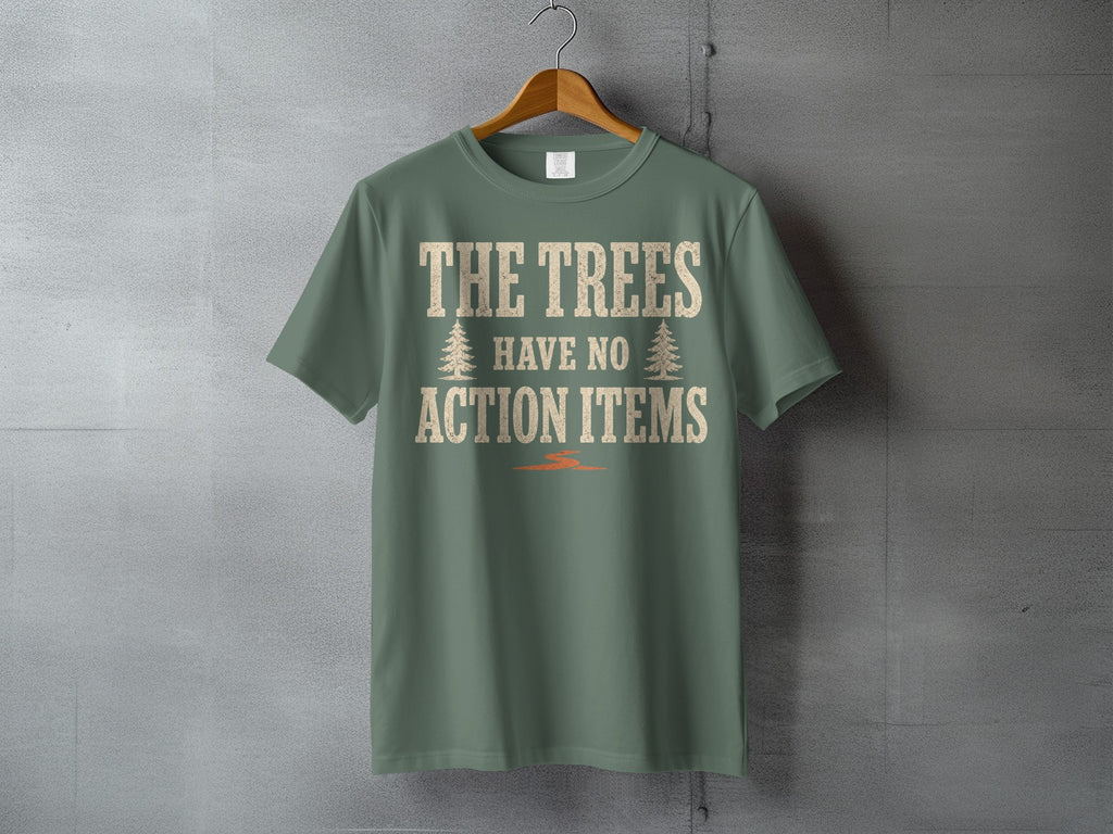 Green t-shirt with cream text reading "THE TREES HAVE NO ACTION ITEMS" and two tree icons.