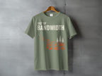 Green t-shirt with "OUT OF BANDWIDTH INTO THE WOODS" text and graphic.