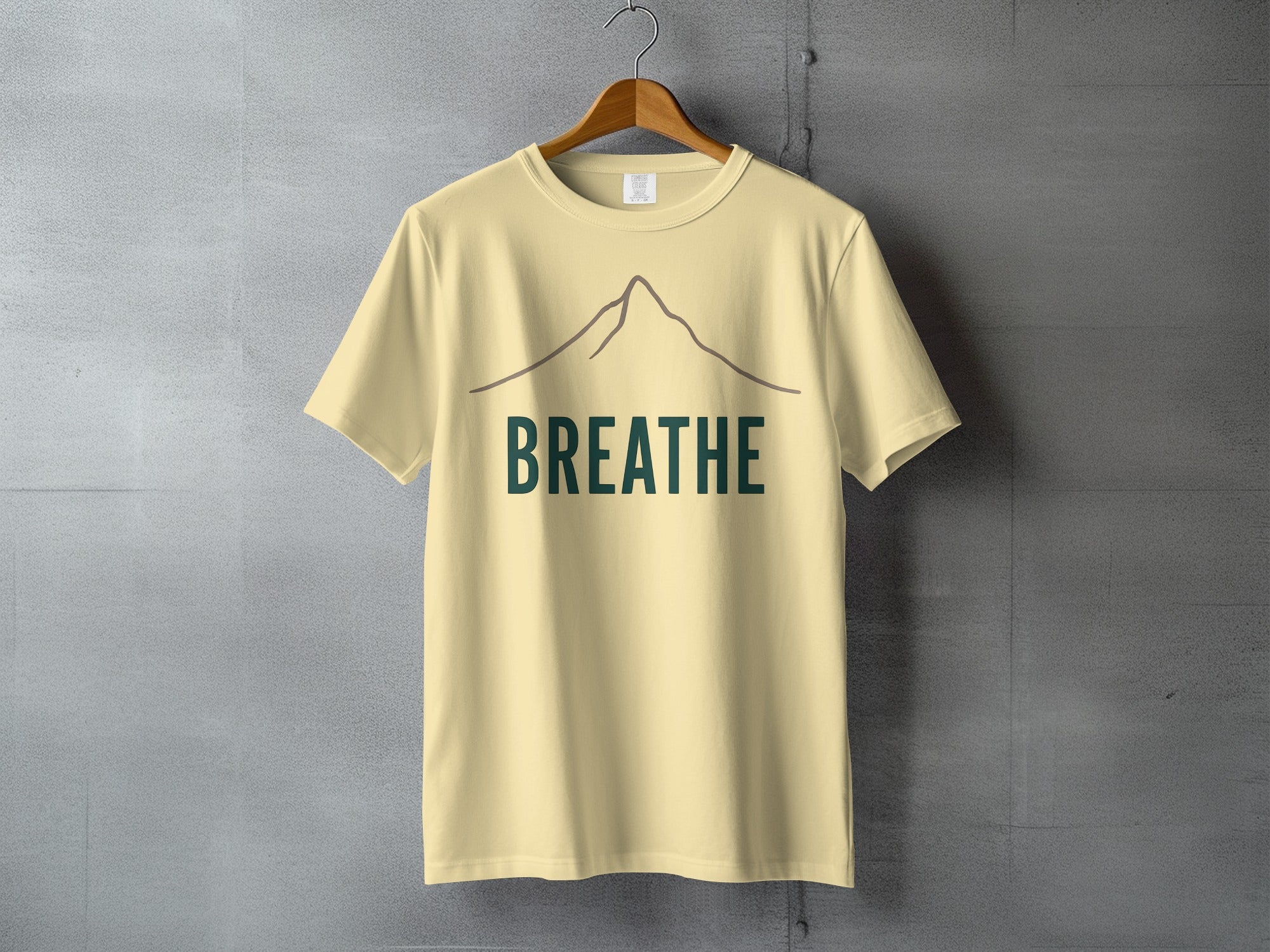 Mountain BREATHE design light yellow product type
Mountain Graphic, BREATHE Text, Yellow Tee, Cream Color, Nature Design, Outdoor Theme, Relaxation, Mindfulness, Wellness Art, Simple Style, Minimalist Look, Inspirational, Adventure Spirit, Peace Calm, Graphic Print, Uplifting Message, Earthy Tones, Mountain Peak, Positive Vibe, Graphic Top