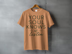 Orange t-shirt with "YOUR SOUL KNOWS Listen" text and a small leaf design.