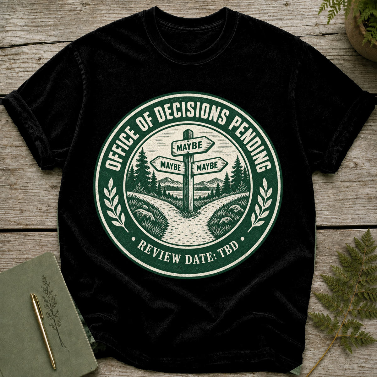 Black t-shirt with "Office of Decisions Pending" and "Review Date: TBD" text.