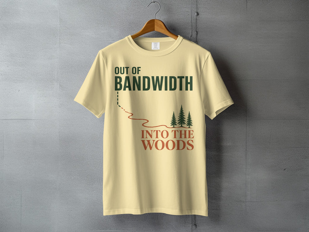 Light yellow t-shirt with "Out of Bandwidth Into The Woods" text and forest graphic.