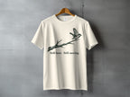 Cream t-shirt with graphic of bird on a branch and text "Still here Still moving."