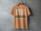 Orange t-shirt with "MENTALLY OUT OF OFFICE" and pine trees.