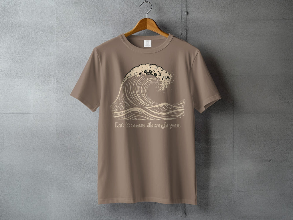 Brown t-shirt with a stylized wave graphic and text "Let it move through you."