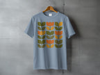 Light Blue Retro Floral Pattern T-shirt product type
T-shirt
Tee
Graphic tee
Floral
Flower
Tulip
Retro
Vintage style
Mid-century modern
Geometric pattern
Orange
Olive green
Light blue
Dusty blue
Botanical print
Nature inspired
Apparel
Clothing
Abstract floral
Fashion