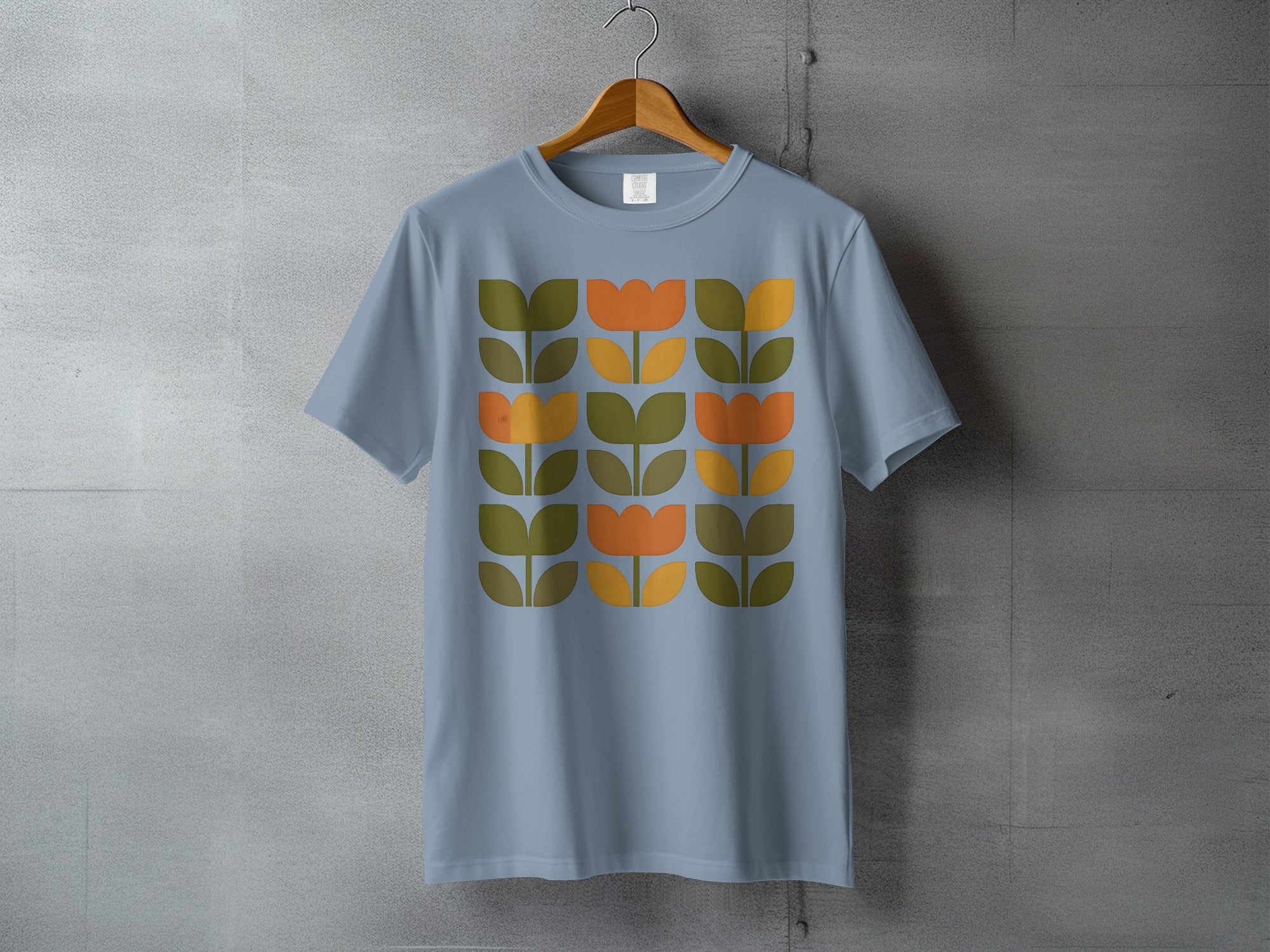 Light Blue Retro Floral Pattern T-shirt product type
T-shirt
Tee
Graphic tee
Floral
Flower
Tulip
Retro
Vintage style
Mid-century modern
Geometric pattern
Orange
Olive green
Light blue
Dusty blue
Botanical print
Nature inspired
Apparel
Clothing
Abstract floral
Fashion