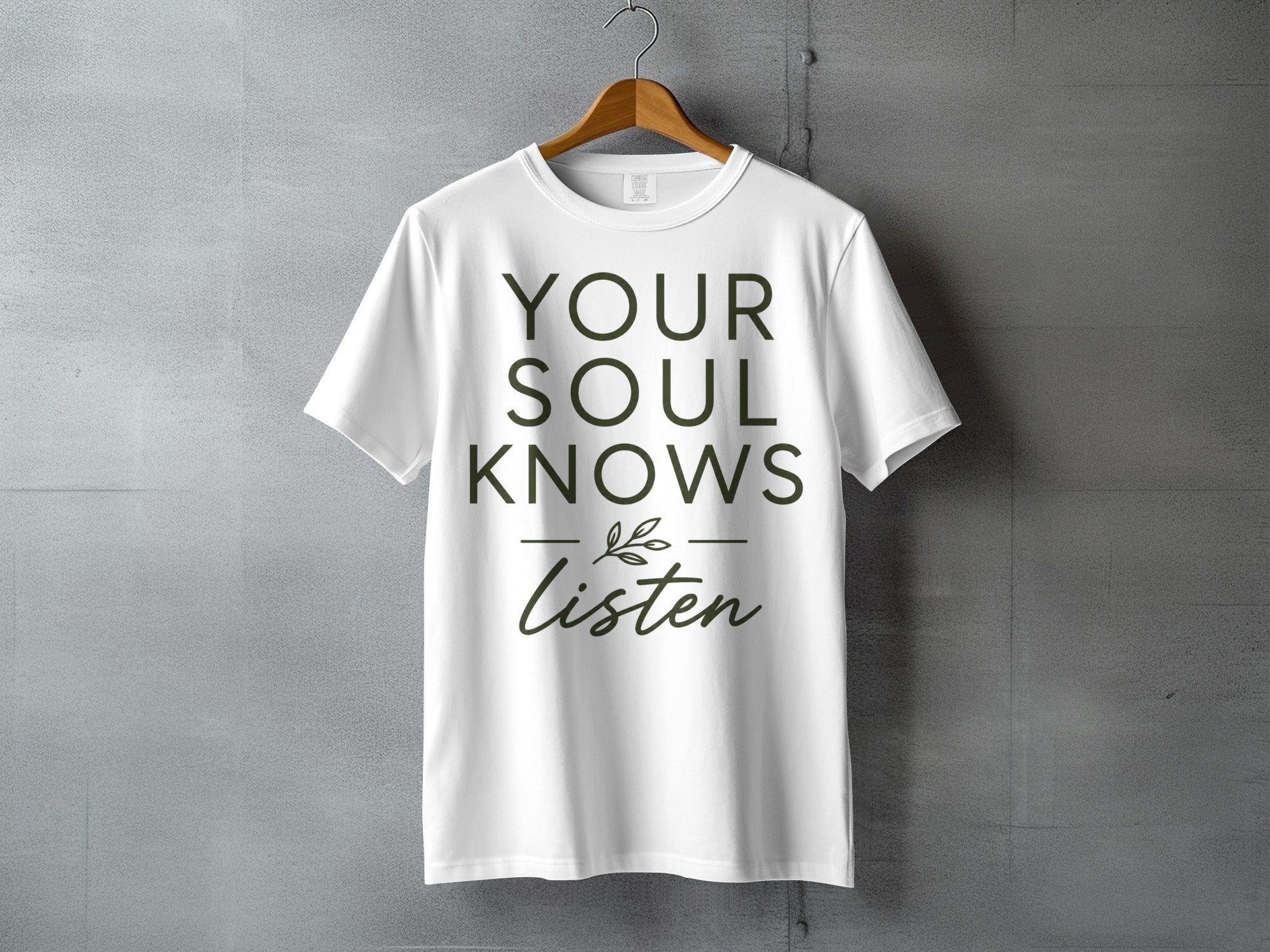White t-shirt with green text "YOUR SOUL KNOWS Listen".
