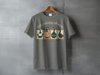 Gray t-shirt with four ducks reading, "Softly spiraling still moving."