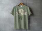 Olive green t-shirt with "Please Advise I'll Be Outside" text and fern graphic.