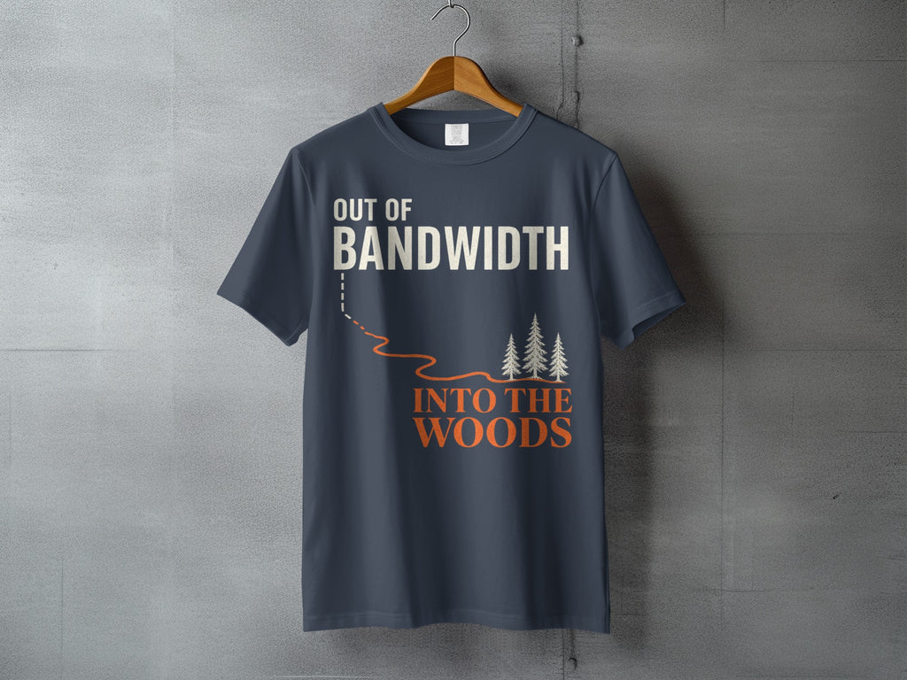 Dark grey t-shirt with "OUT OF BANDWIDTH INTO THE WOODS" text and pine trees.