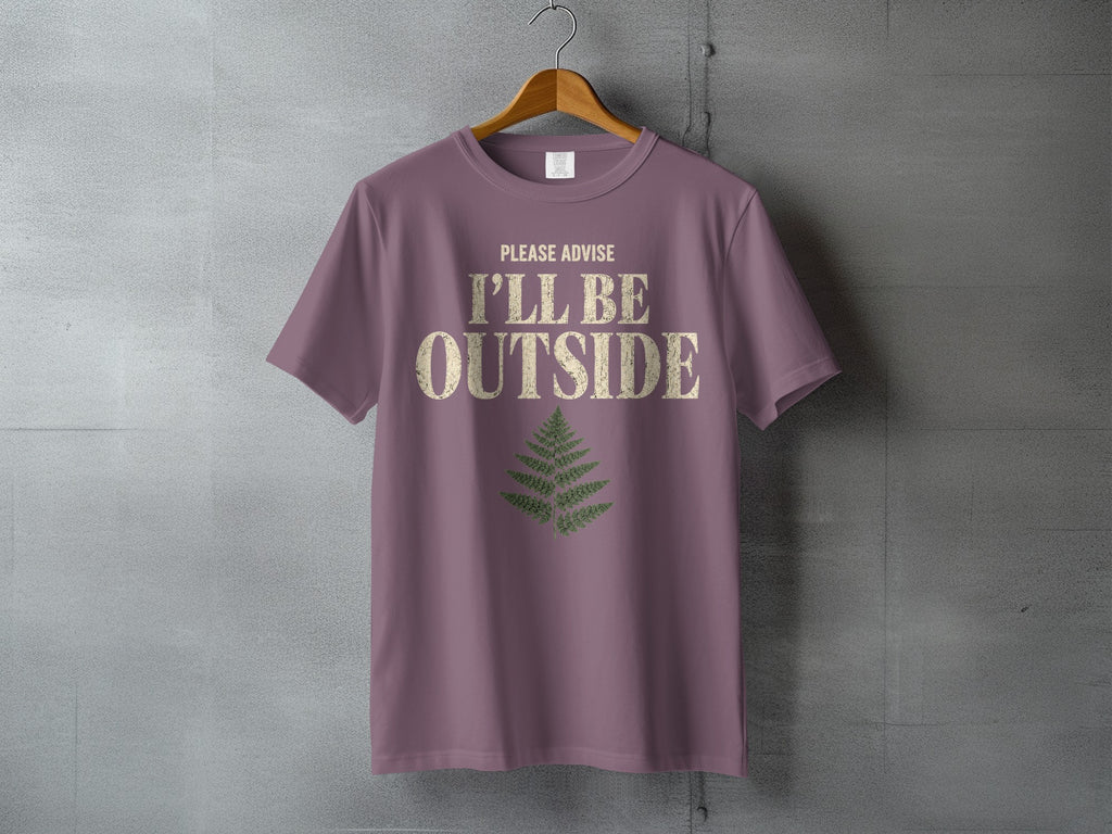 Mauve t-shirt with distressed text "PLEASE ADVISE I'LL BE OUTSIDE" and fern graphic.