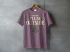 Mauve t-shirt with distressed text "PLEASE ADVISE I'LL BE OUTSIDE" and fern graphic.