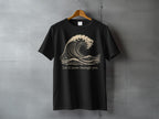 Black t-shirt with a stylized wave graphic and the text "Let it move through you."