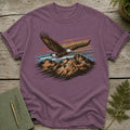 Purple t-shirt with a graphic of an eagle flying over mountains and a striped sky.