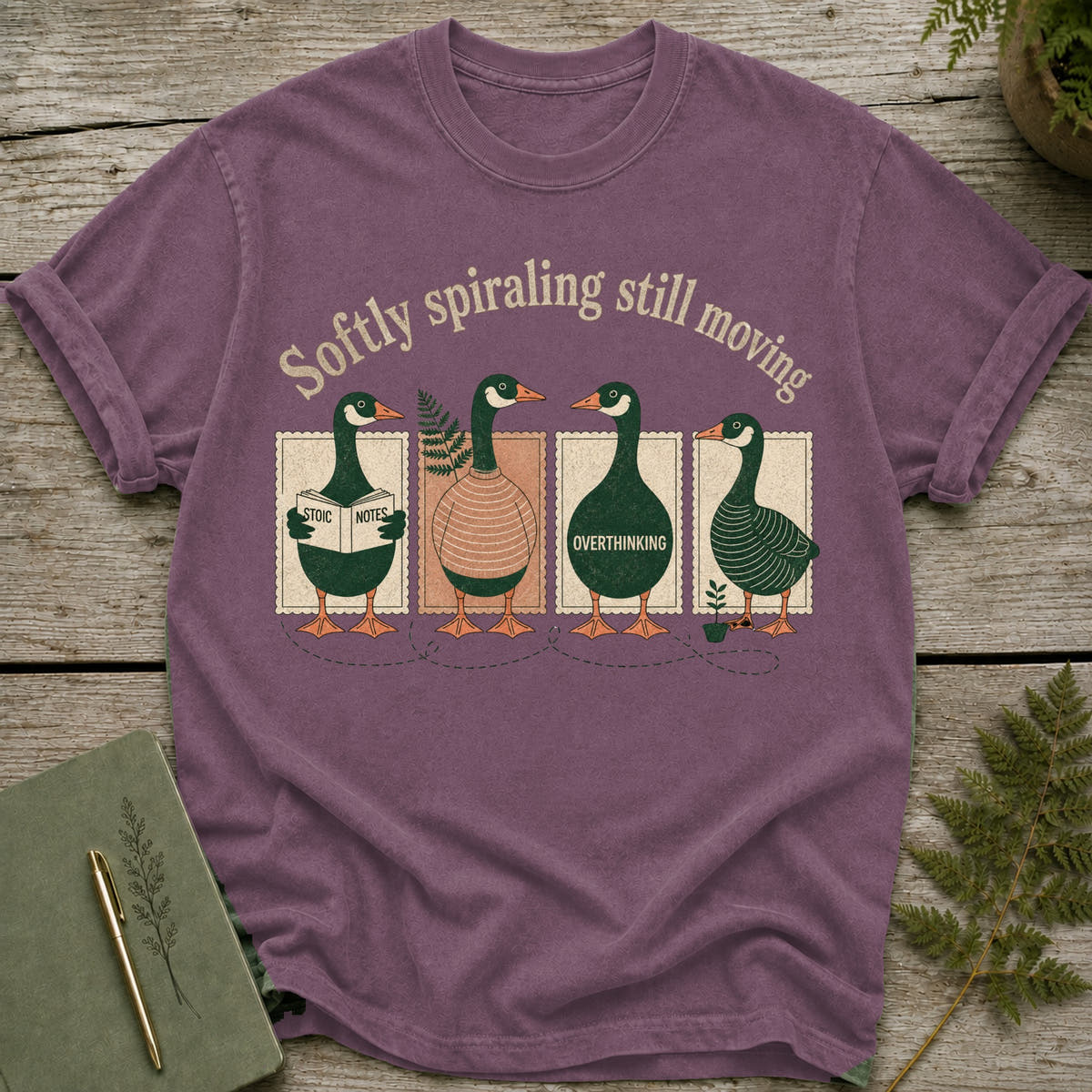 T-shirt with four geese, text "Softly spiraling still moving," and individual goose descriptions.