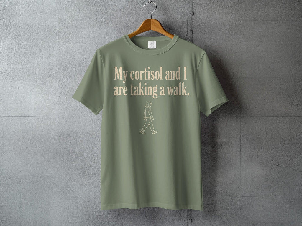 Green t-shirt with "My cortisol and I are taking a walk." text.