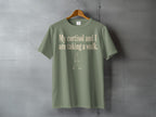 Green t-shirt with "My cortisol and I are taking a walk." text.