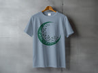 Moonlit Foliage Crescent Starry Blue Celestial Apparel Product Type
T-Shirt
Graphic Tee
Crescent Moon
Moon Design
Foliage Print
Leaf Design
Celestial Art
Mystical Top
Nature Inspired
Starry Sky
Blue Shirt
Green Design
Botanical Moon
Witchy Vibes
Boho Style
Esoteric Fashion
Unique Print
Spiritual Wear
Aesthetic Tee
Outdoors Theme