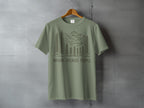 Olive green t-shirt with line art trees, mountains, and "NATURE. BECAUSE PEOPLE." text.