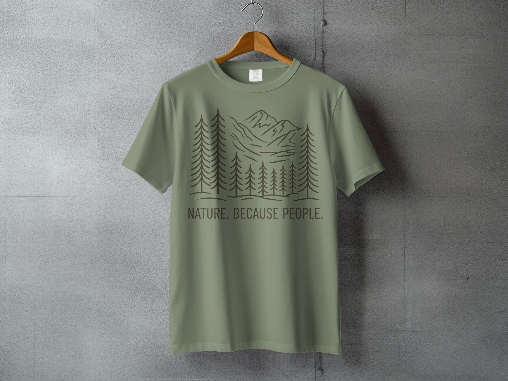 Olive green t-shirt with line art trees, mountains, and "NATURE. BECAUSE PEOPLE." text.
