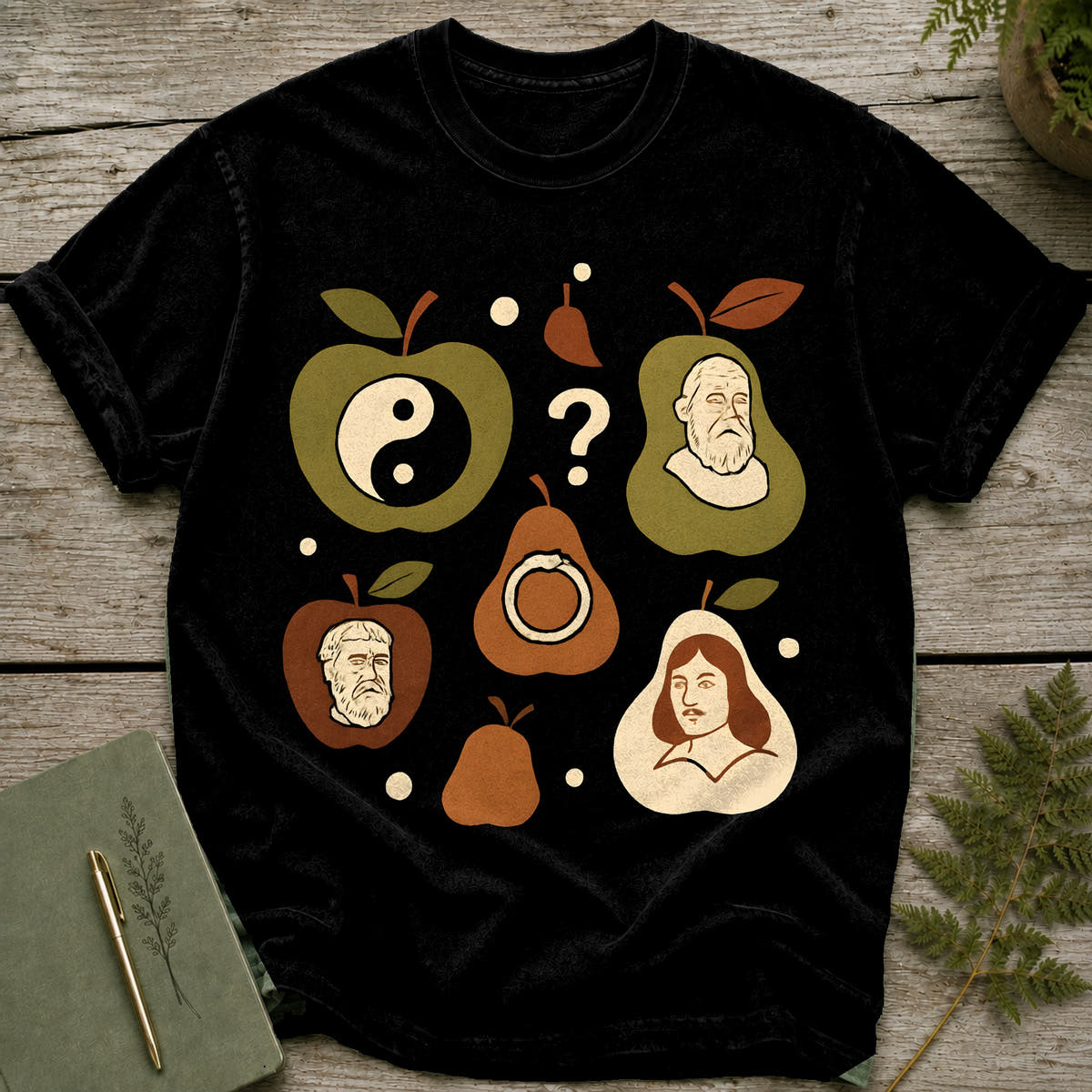 Black t-shirt featuring stylized portraits of historical figures within fruit shapes.