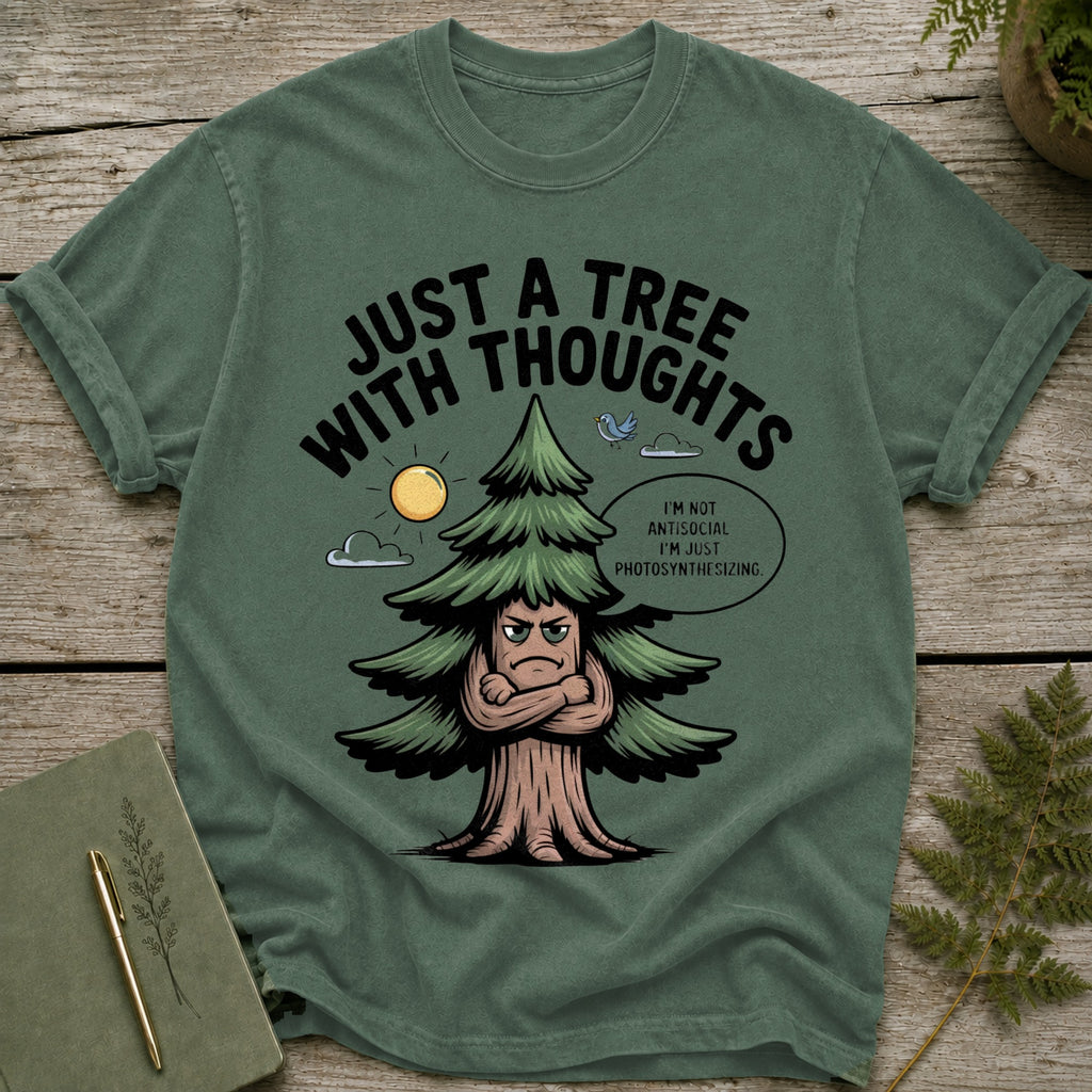 Green t-shirt with a cartoon tree with arms crossed and the text "Just a tree with thoughts".