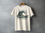 Cream t-shirt with a dark green wave graphic and the text "Let it move through you."