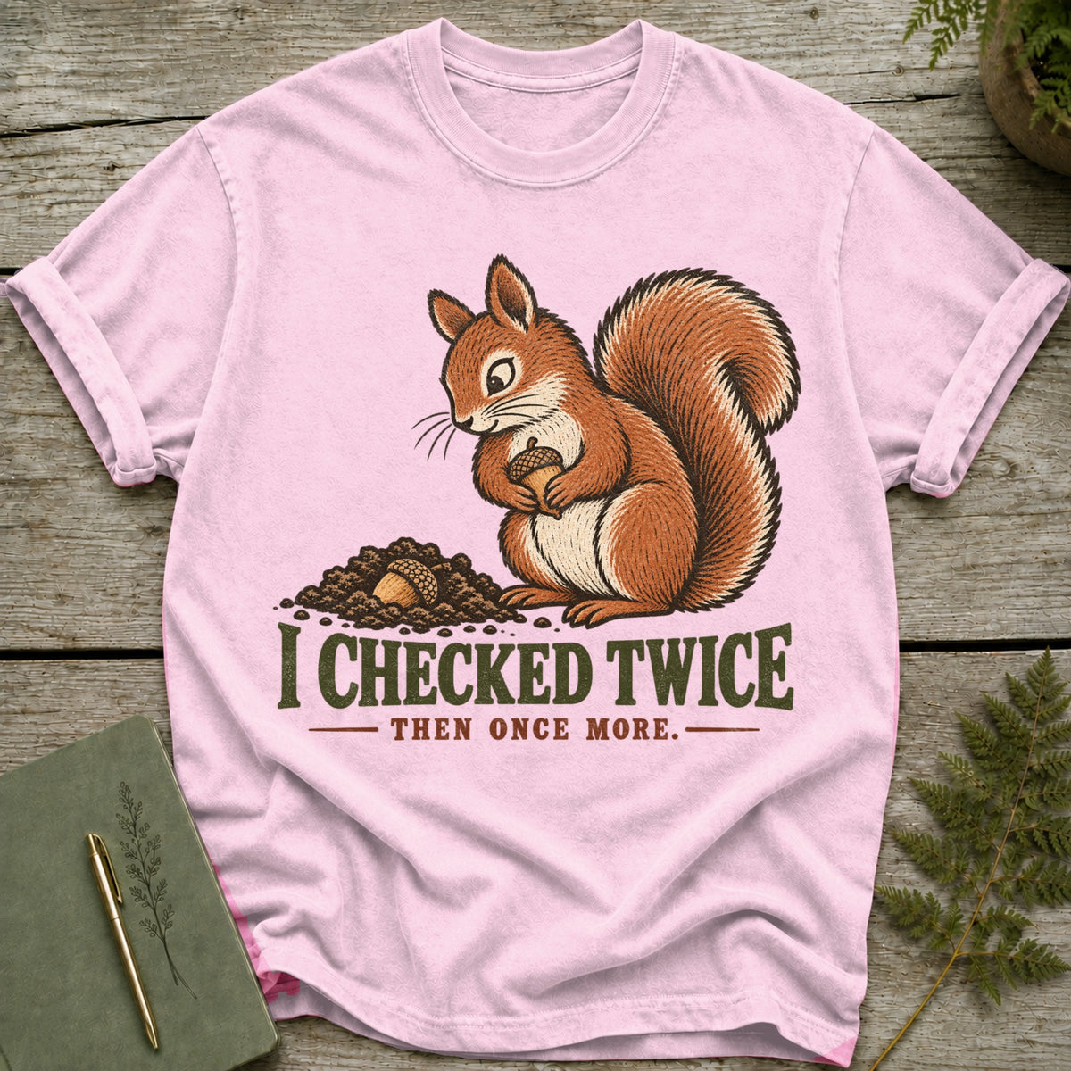 Pink t-shirt with a squirrel and acorns, text reads "I CHECKED TWICE THEN ONCE MORE."