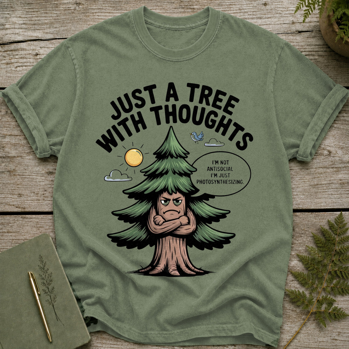 Green t-shirt with a cartoon tree that says "Just a Tree With Thoughts".