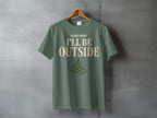 Green t-shirt with "PLEASE ADVISE I'LL BE OUTSIDE" text and fern graphic.