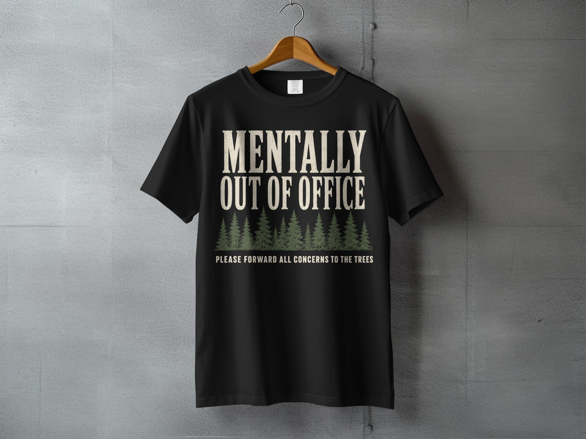 Black t-shirt with "Mentally Out of Office" and trees graphic.