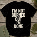 Black t-shirt with distressed white text reading "I'M NOT BURNED OUT I'M DONE".