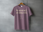 Mauve t-shirt with text "My cortisol and I are taking a walk." and a walking figure.