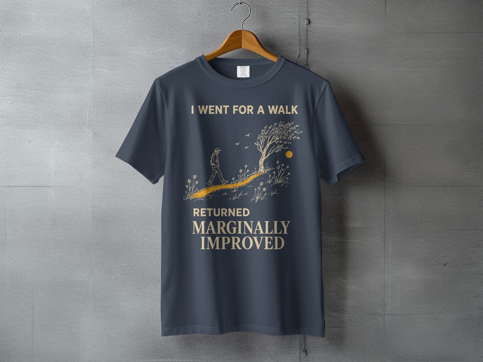 Dark blue t-shirt with text "I WENT FOR A WALK RETURNED MARGINALLY IMPROVED".
