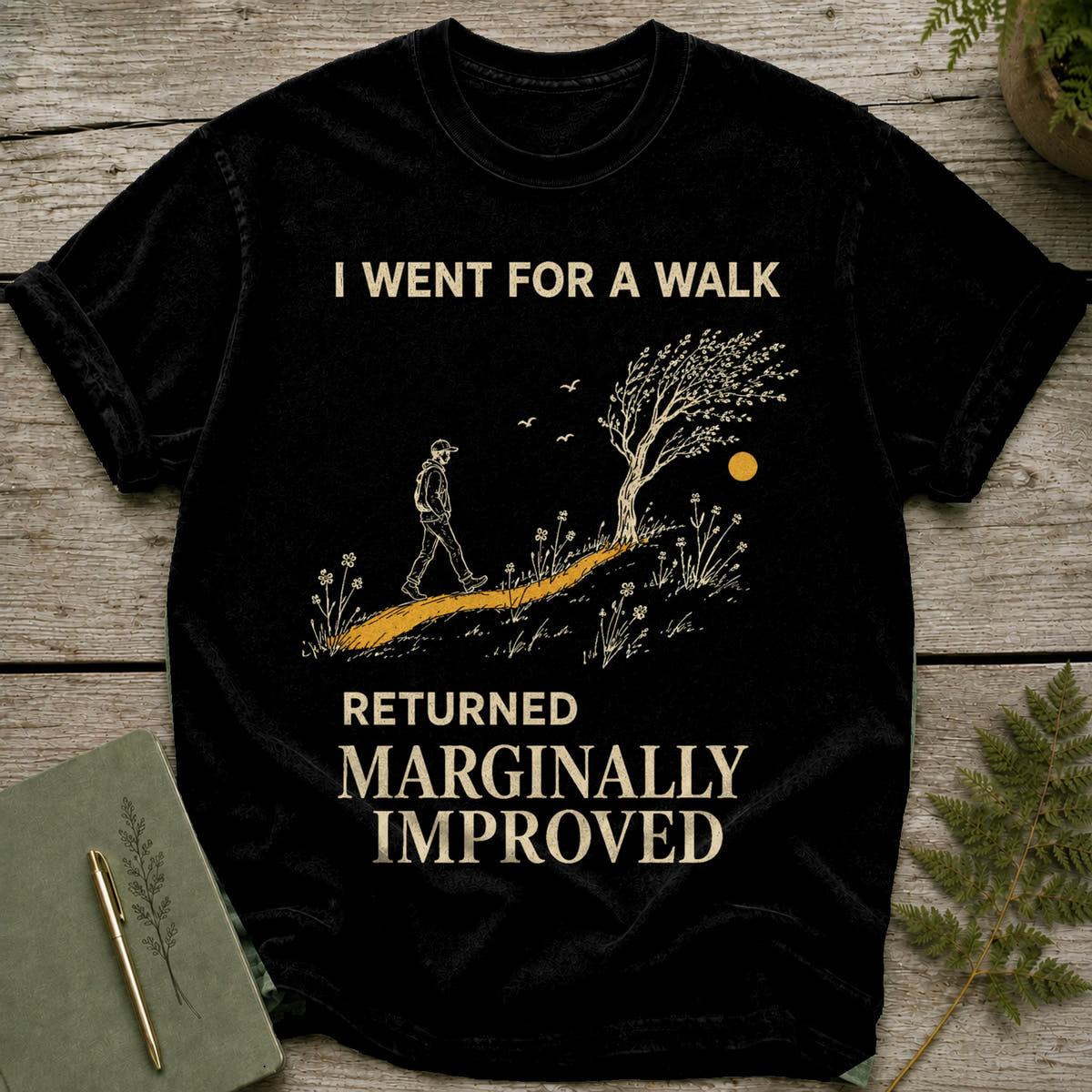 Black t-shirt with graphic: "I WENT FOR A WALK RETURNED MARGINALLY IMPROVED."