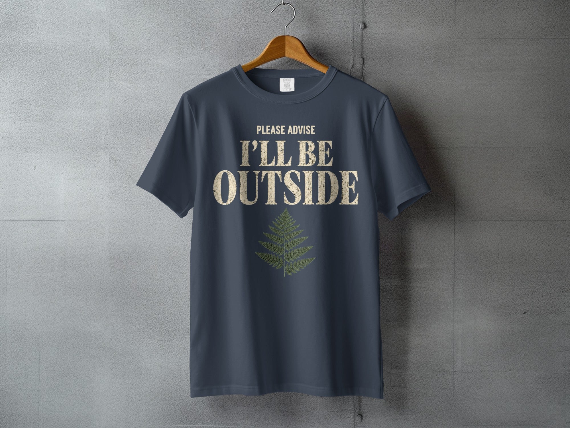 Dark grey t-shirt with "PLEASE ADVISE I'LL BE OUTSIDE" and fern graphic.