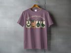 Four cartoon geese wearing vests stand on a line, t-shirt graphic.
