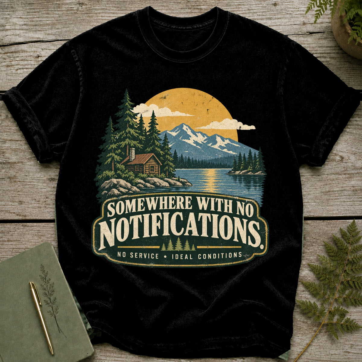 Black t-shirt with "Somewhere With No Notifications" text and a nature scene.