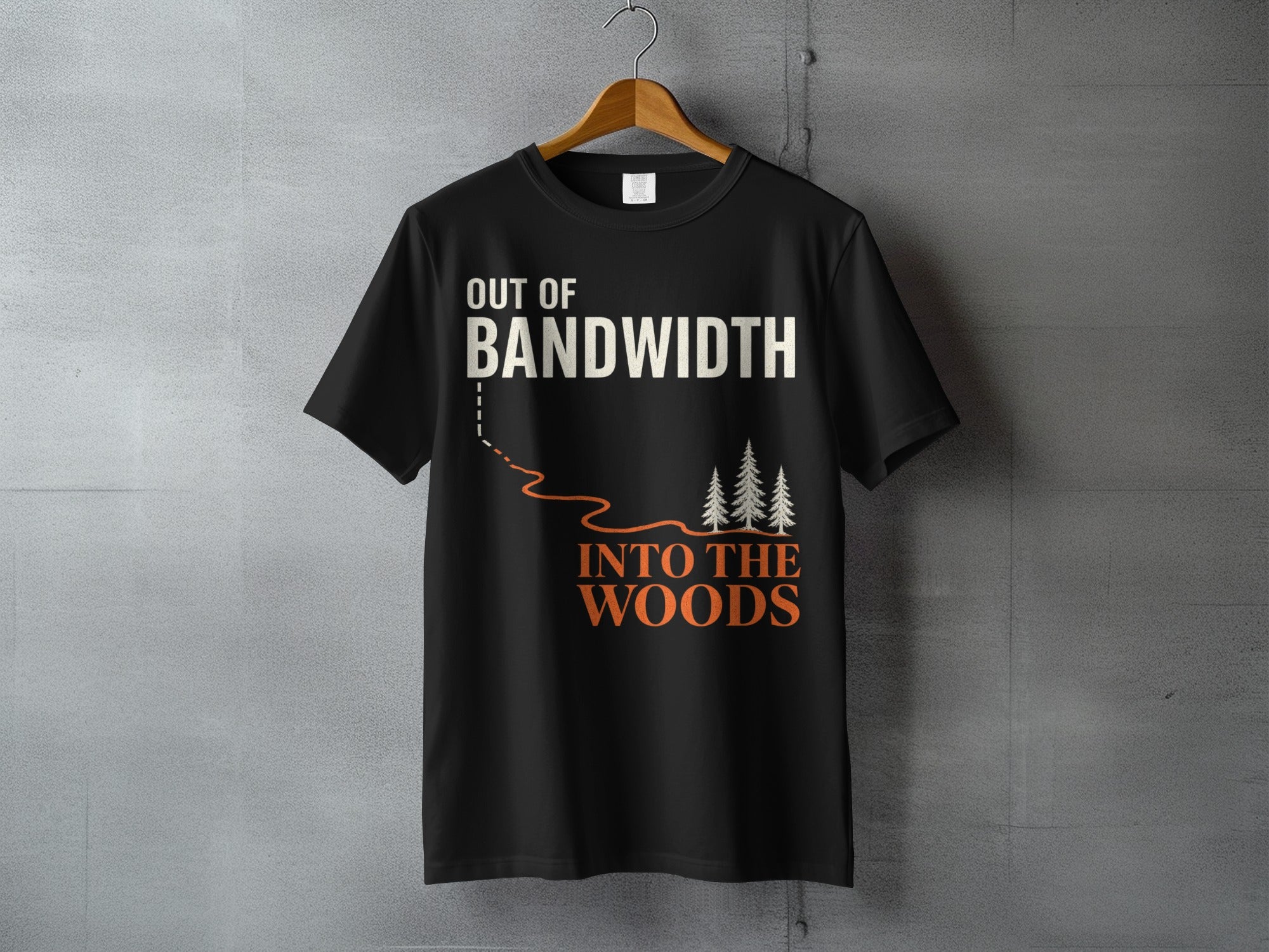 Black t-shirt with "OUT OF BANDWIDTH INTO THE WOODS" text and pine trees graphic.