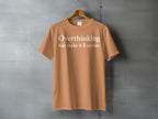 Orange t-shirt with white text "Overthinking but make it 🌲 scenic".