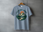 Explore More Mountain River Sun Forest Graphic T-Shirt
explore more, mountain, nature, landscape, outdoor, adventure, forest, trees, river, sun, graphic tee, scenic, hiking, camping, travel, wanderlust, wilderness, blue shirt, retro design, vintage look