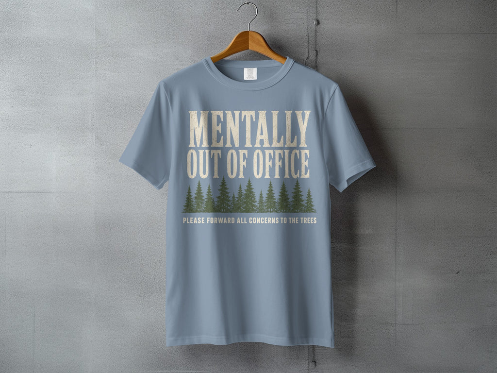Light blue t-shirt with "MENTALLY OUT OF OFFICE" and trees graphic.