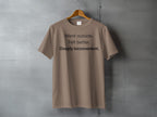 Brown t-shirt with "Went outside. Felt better. Deeply inconvenient." printed on the chest.