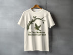 Cream t-shirt with a bird flying from a branch and text "In The Moment The Rest Can Wait".