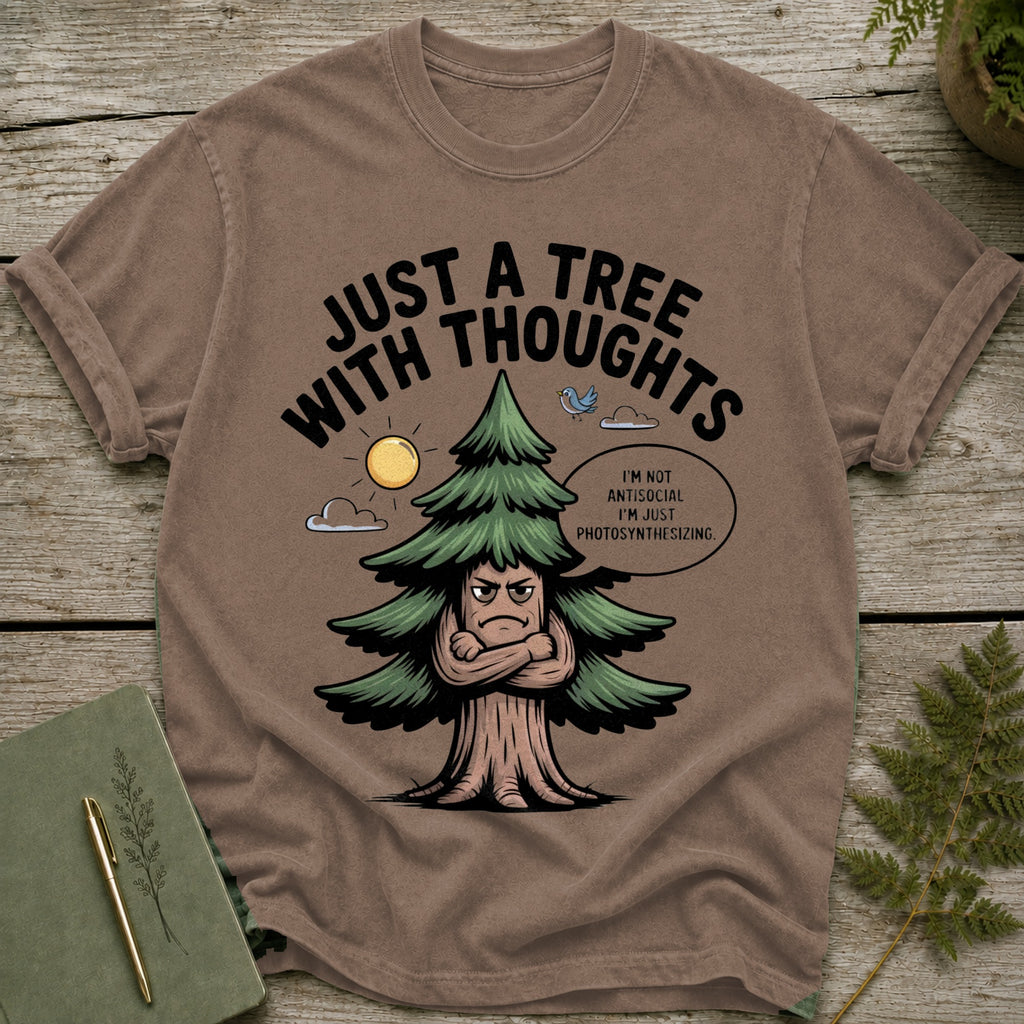 Brown t-shirt with a cartoon tree saying "Just a tree with thoughts."