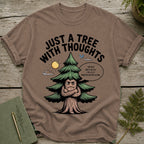 Brown t-shirt with a cartoon tree saying "Just a tree with thoughts."