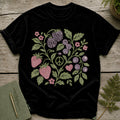 Black t-shirt with a black graphic featuring berries, strawberries, flowers, and a peace sign.