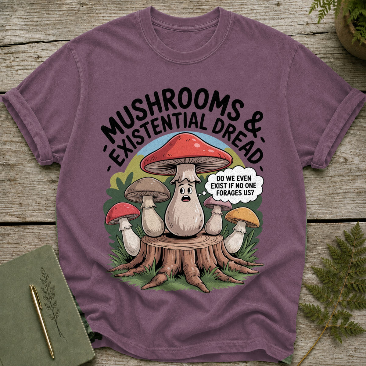 T-shirt with "MUSHROOMS & EXISTENTIAL DREAD" text and worried mushrooms.