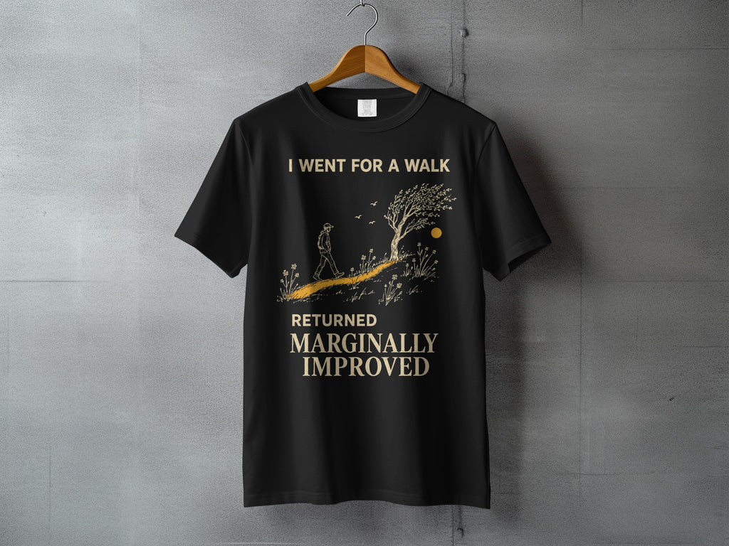 Black t-shirt with text "I WENT FOR A WALK RETURNED MARGINALLY IMPROVED" and illustrated landscape.